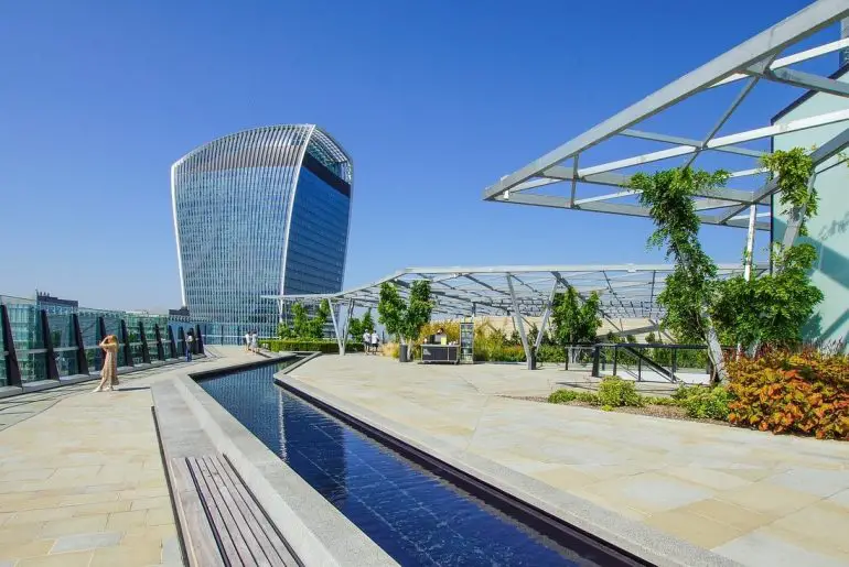 How do rooftop gardens promote sustainability